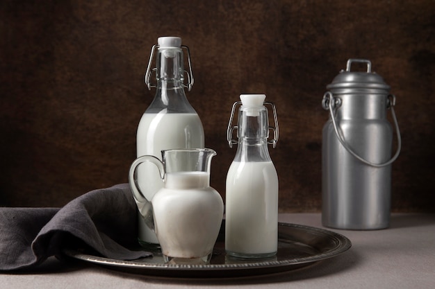 Free photo bottles of milk arrangement still life