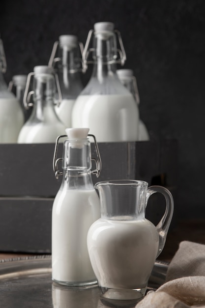 Free photo bottles of milk arrangement still life