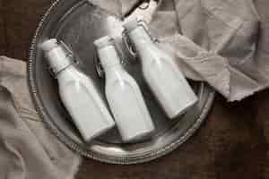 Free photo bottles of milk arrangement still life