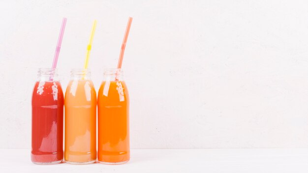 Bottles of multicolored juice