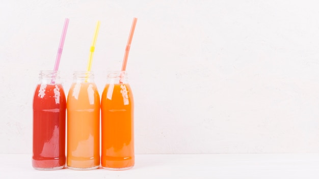 Bottles of multicolored juice