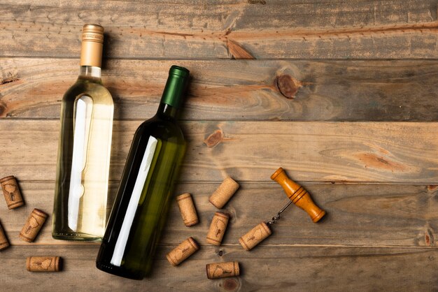 Bottles of wine laid on a wooden table