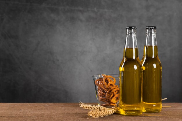 Bottles with beer and snacks