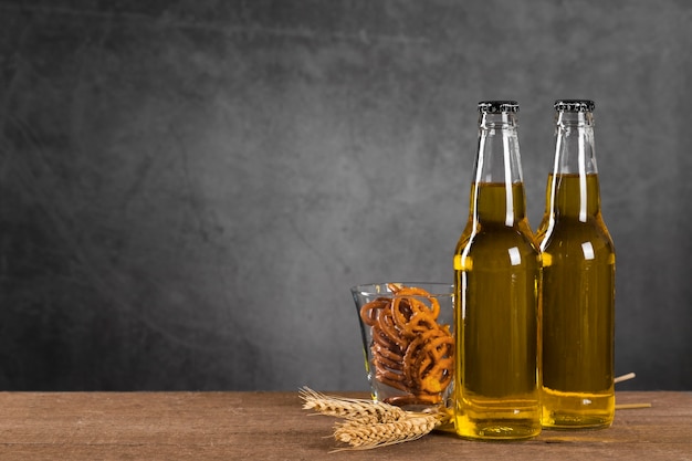 Bottles with beer and snacks