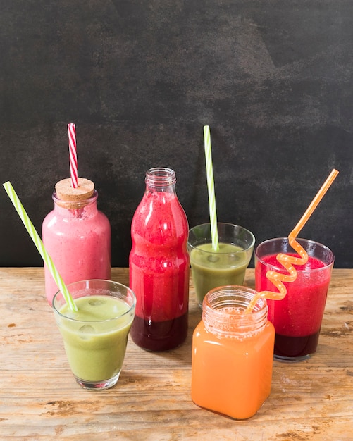 Bottles with fruits smoothie