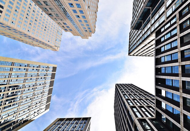 Bottom view of buildings with sky background