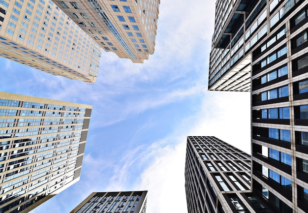 Bottom view of buildings with sky background