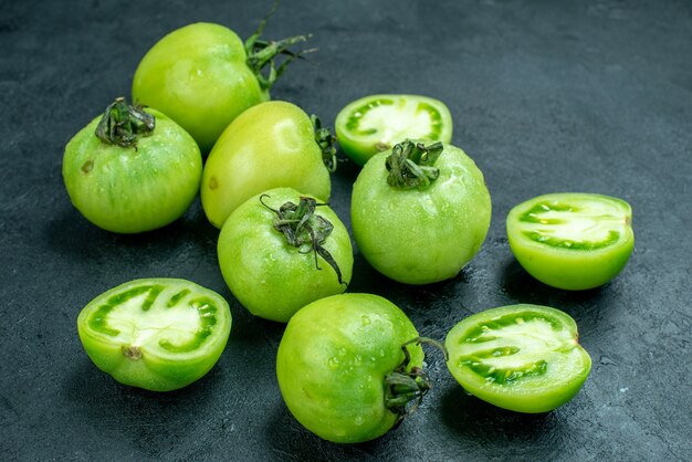 Bottom view chopped tomatoes fresh green tomatoes on dark table