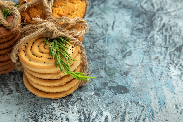 Bottom view cookies tied with ropes on grey background free place