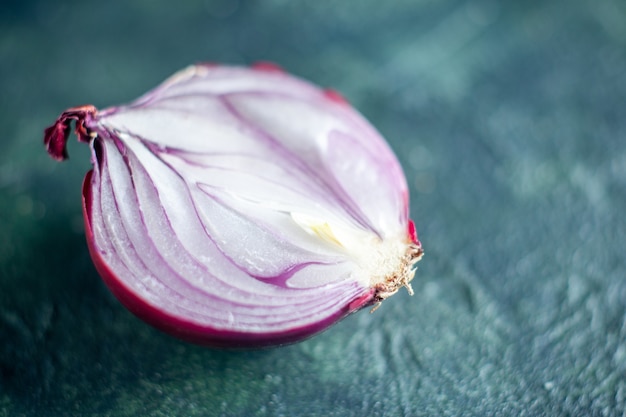 Bottom view cut red onion on dark