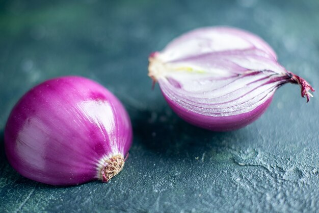 Bottom view cut red onions isolated on dark