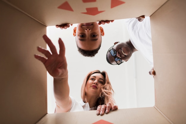 Bottom view family looking into a box