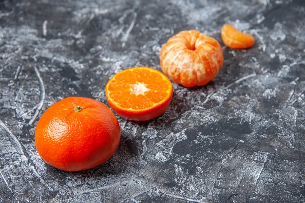 Bottom view fresh mandarins peeled mandarins on table copy space