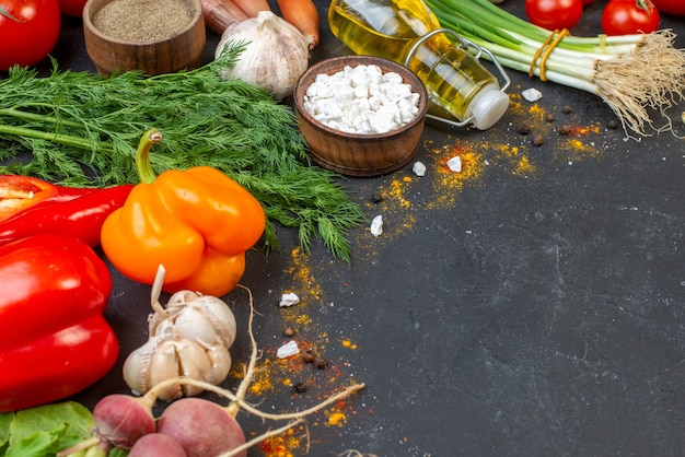 Bottom view fresh vegetables sea salt in small bowl oil bottle on table free space