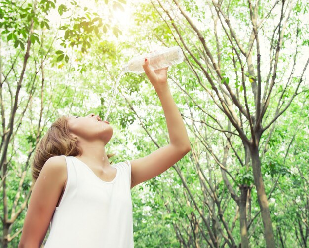 Bottom view of girl drinking water