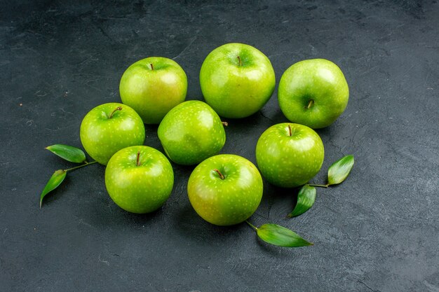 Bottom view green apples on dark surface