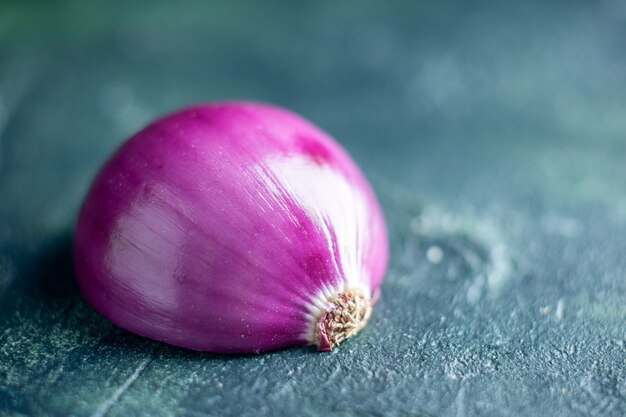 Bottom view half red onion isolated on dark