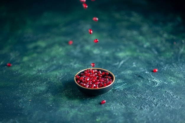 Bottom view pomegranate seeds bowl on table free space