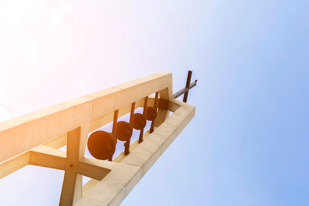 Free photo bottom view religious monument with cross on top