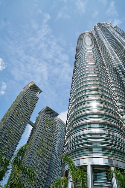 Bottom view of skyscrapers with decorative plants