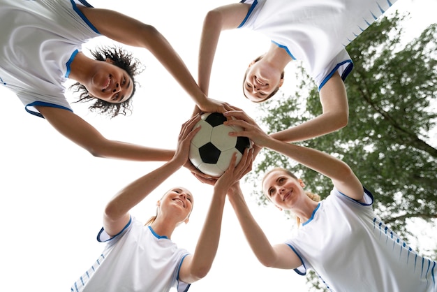 Bottom view women holding ball