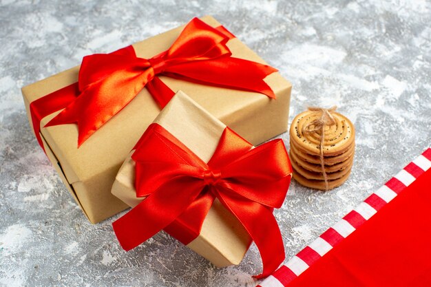 Bottom view xmas gifts cookies tied with rope on grey background