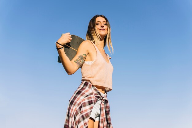 Bottom view of young skater girl