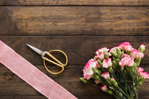 Bouquet of blooms, scissors and ribbon