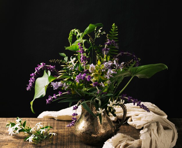 Bouquet of blooms in vase on table