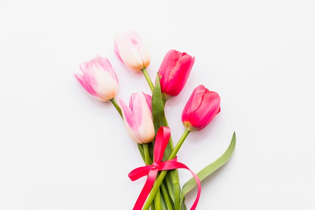 Bouquet of bright fresh flowers in ribbon