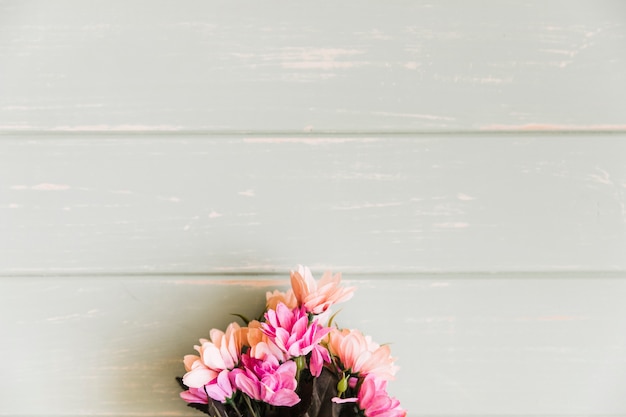 Bouquet of flower on wooden plank