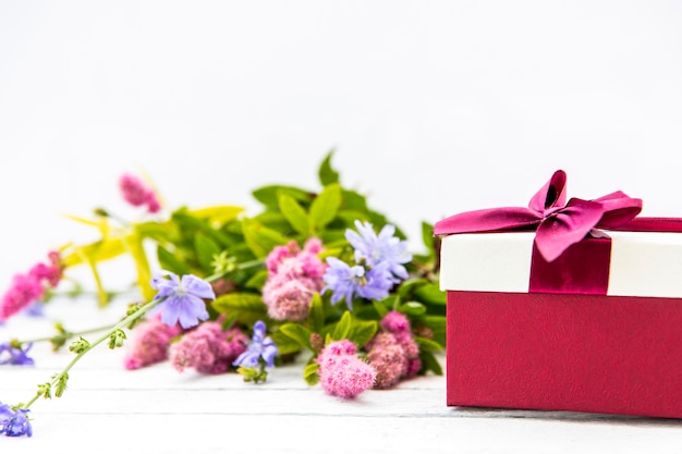 Bouquet of flowers and cute gift