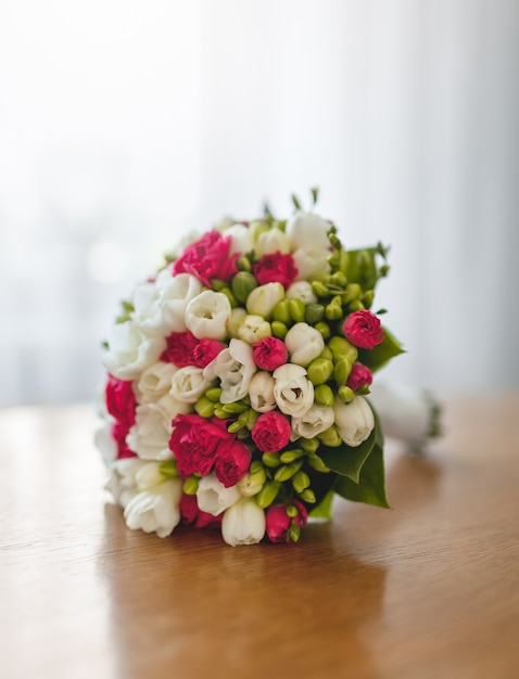 Bouquet of fresh flowers on table