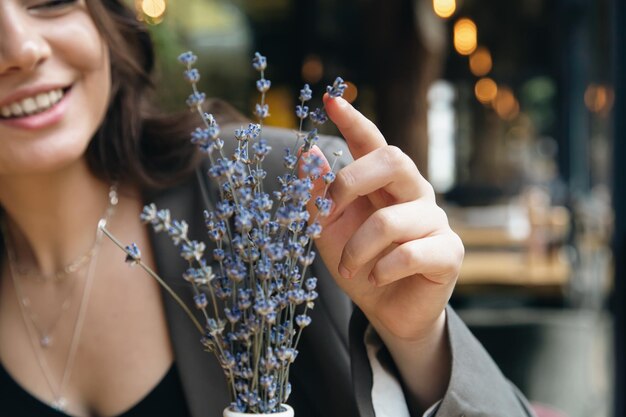 A bouquet of lavender flowers in a cafe on a table on a blurred background