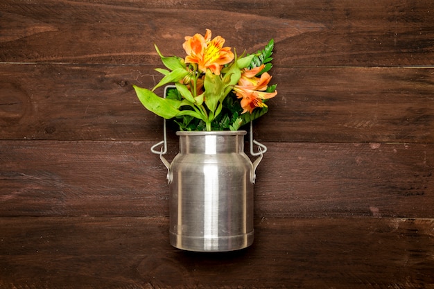 Bouquet of lilies in metal water can