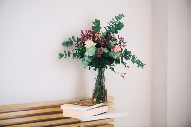 Bouquet near books