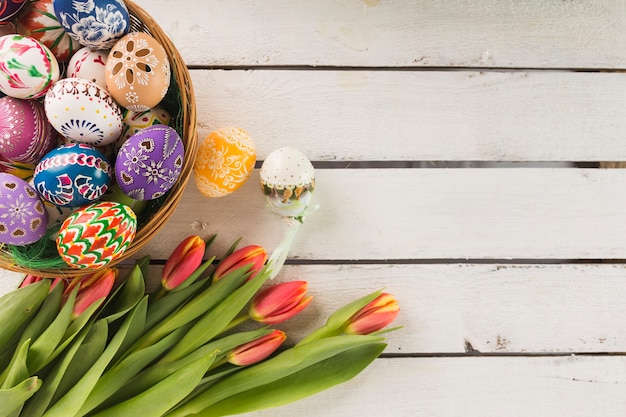 Bouquet near bowl with eggs