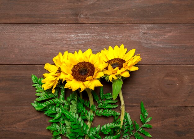 Bouquet of sunflowers and fern leaves