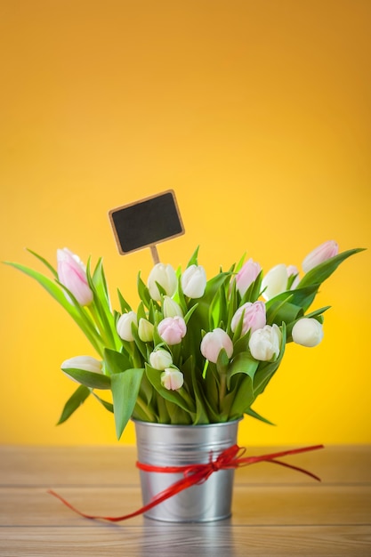 Bouquet of tulips in rustical pot