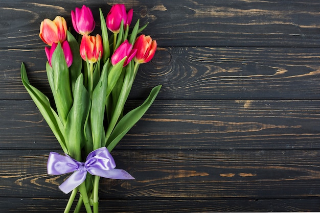 Free photo bouquet of tulips with bow