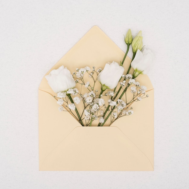Bouquet of white roses in an envelope
