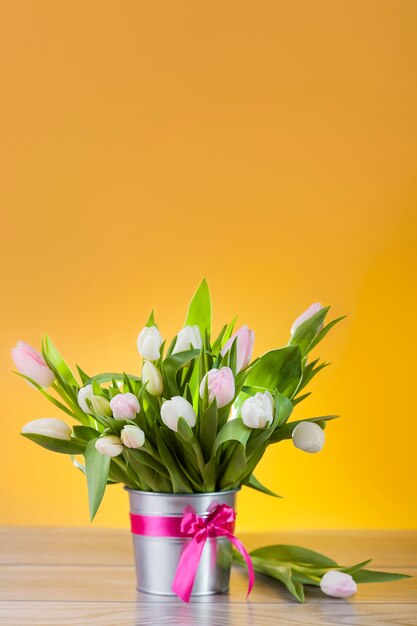 Bouquet of white tulips in lovely pot