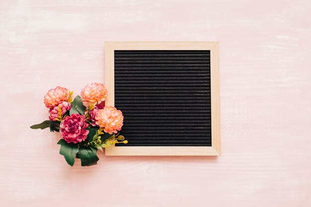bouquet with blackboard on vintage background