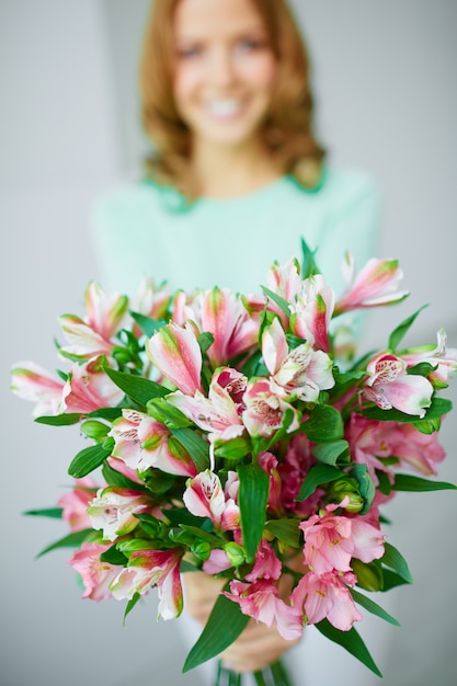 Bouquet with woman blurred background