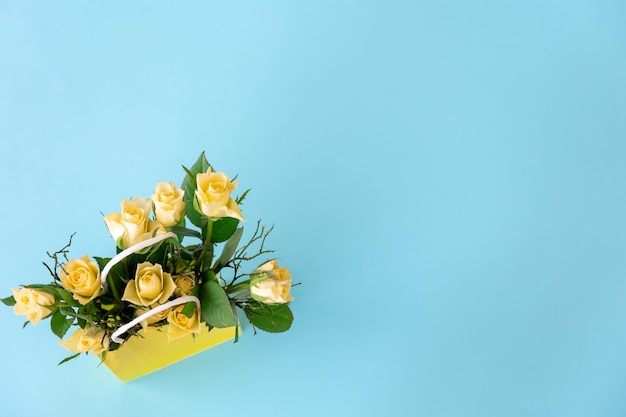 Bouquet Of Yellow Flowers On A Blue Background Flat Lay