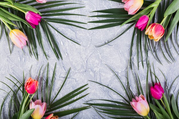 Bouquets of tulips and palm leaves