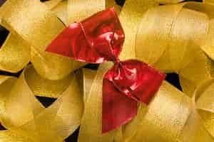 Free photo bow on golden ribbon