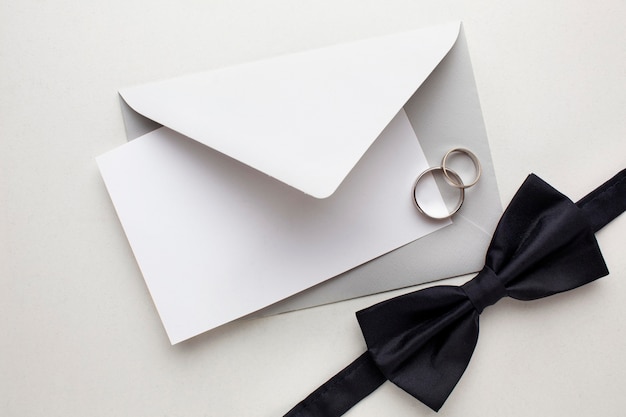 Bow tie and envelopes save the date wedding concept