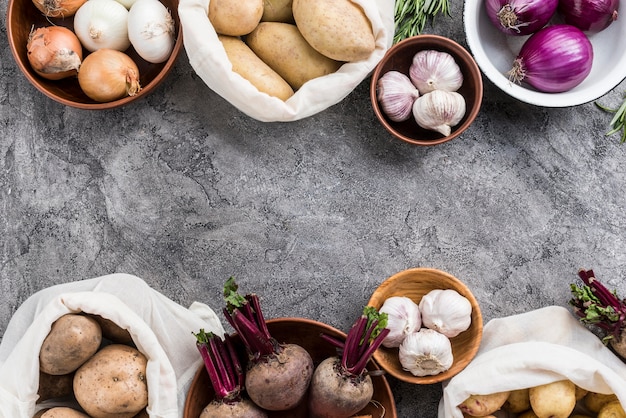 Free photo bowl and bags with vegetables