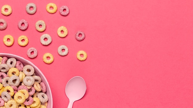 Bowl of cereal fruit loops with spoon and copy space